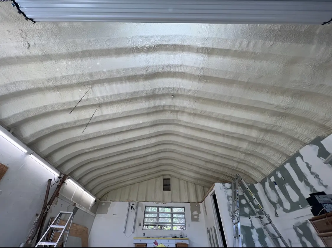 Spray polyurethane foam applied to the underside of a metal roof deck in Bensley